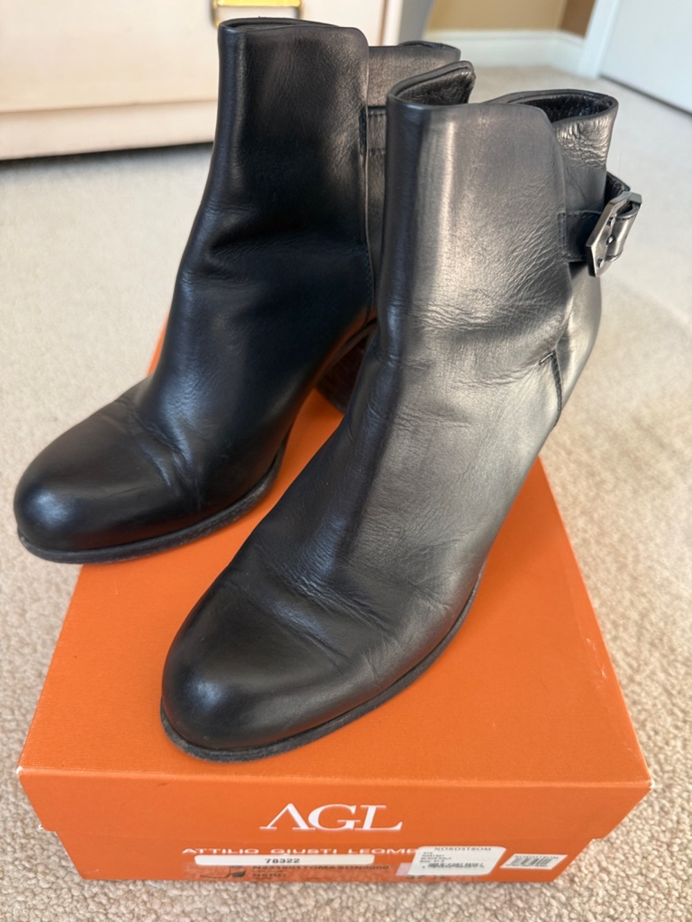 AGL Black Leather Ankle Booties with Buckle Accent